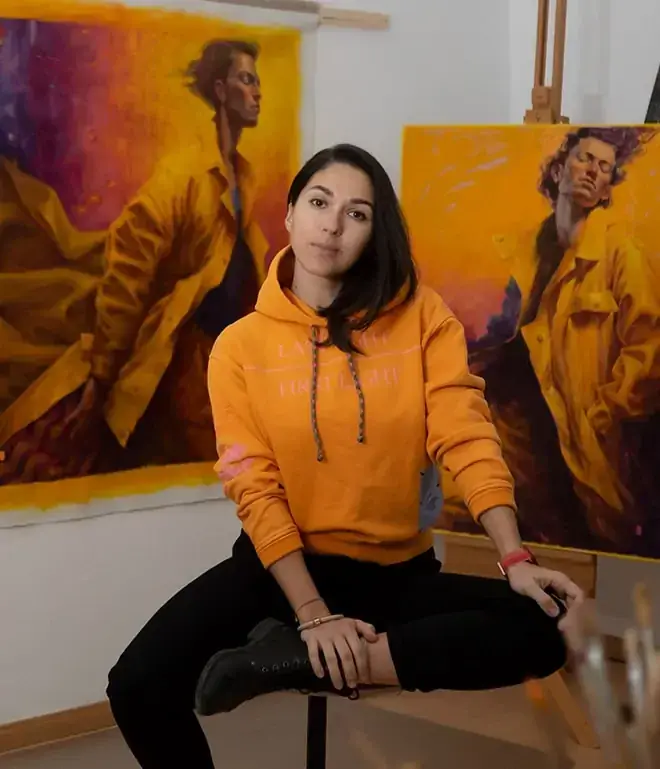 Tania Rivilis in her studio with paintings